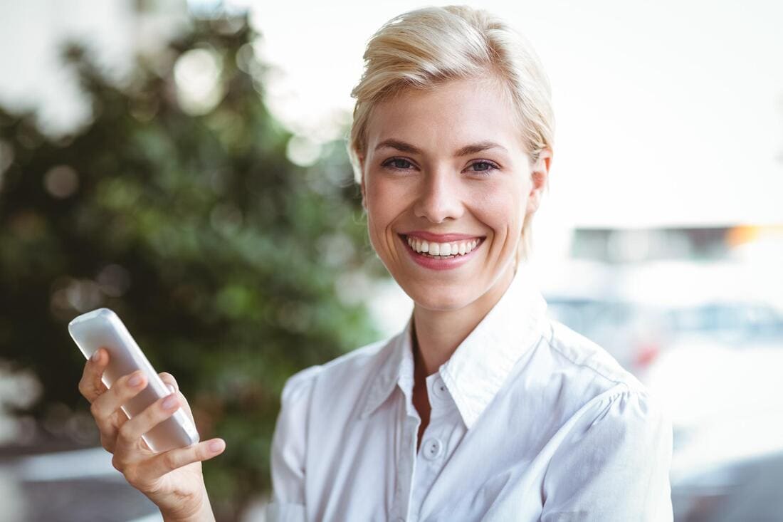 Person speaking on a phone in an office