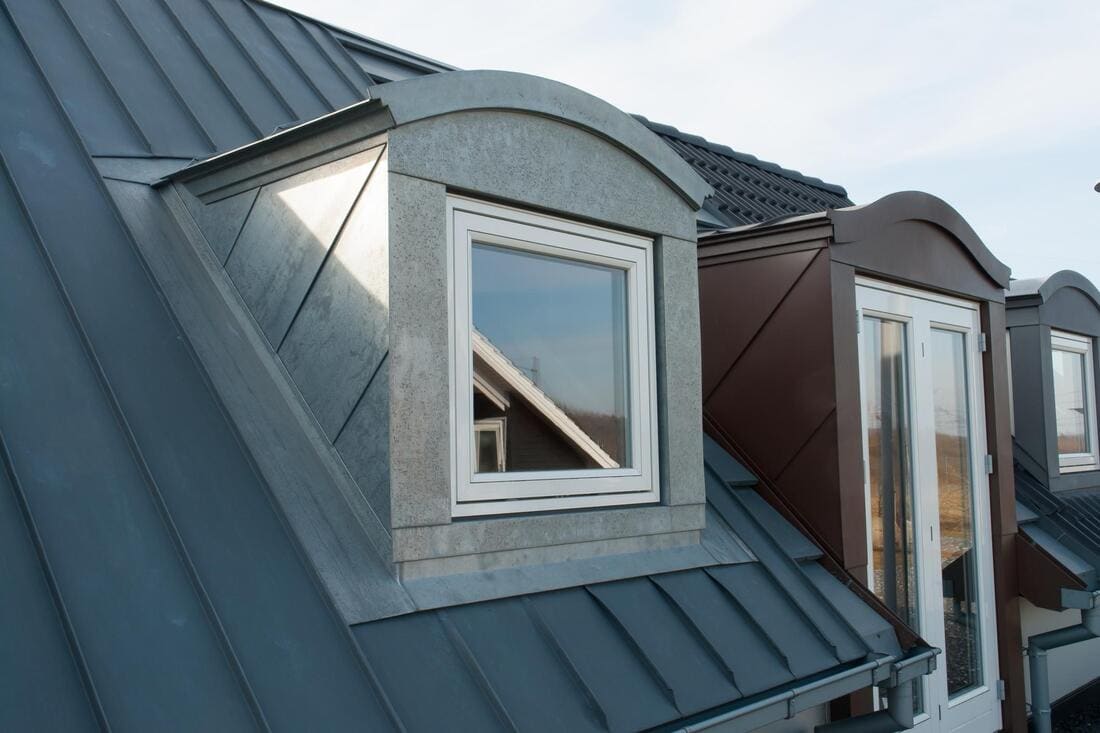 Standing-seam dormers on a roof